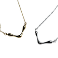 Two gold and silver necklaces on a white background