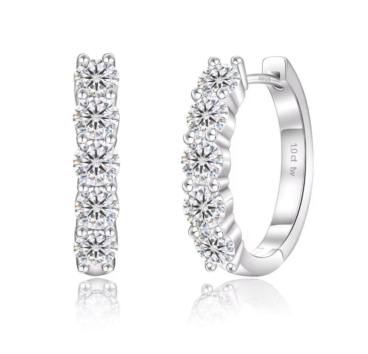 Pair of silver hoop earrings with clear gemstones on a white background