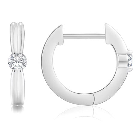 Silver hoop earrings with clear gemstones on a white background